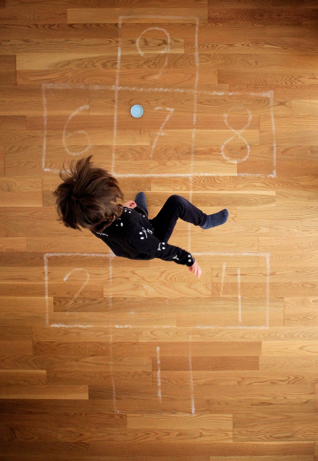 A boy plays hopscotch at his home in A Coruna, Spain, on April 23. Cabalar-EPA-EFE-Shutterstock.jpg