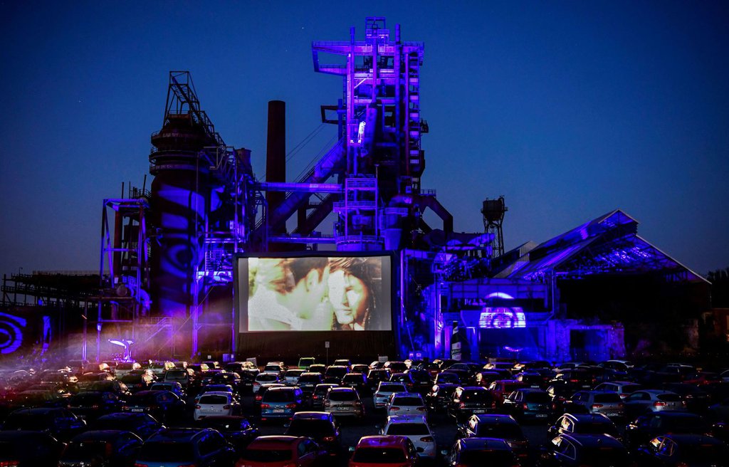 Cars sit at a newly opened drive-in cinema in Dortmund, Germany, on April 17. It's in front of a former blast furnace.Ina Fassbender-AFP-Getty Images.jpg