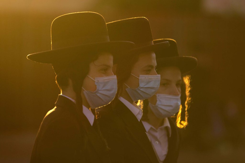 Ultra-Orthodox Jews gather for a July 13 protest over lockdown measures in Jerusalem.Oded Balilty-AP.jpg
