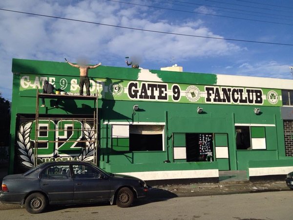 Historic Gate 9 fanclub building painted green and white