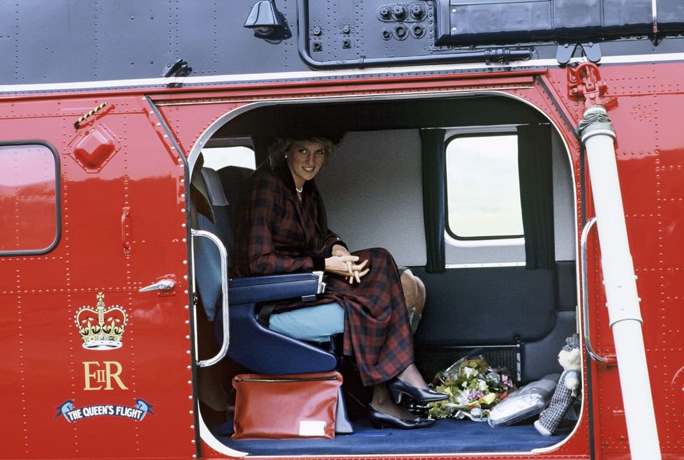 Arriving in Scotland on a Queen's Flight helicopter in a tartan dress and black pumps 1985.jpg
