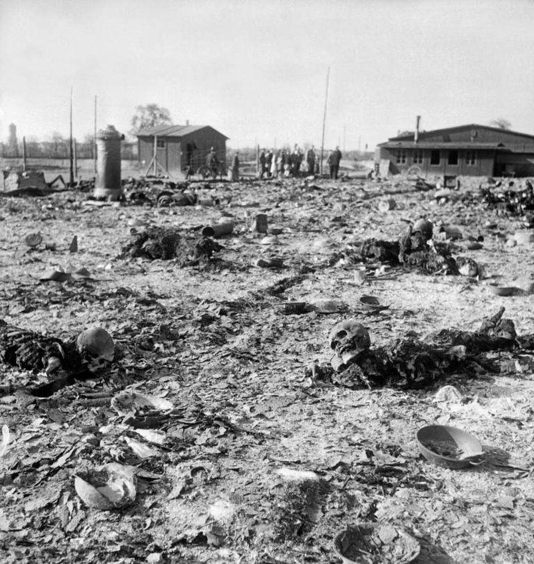 Burnt bodies lie on the grounds of the Thekla concentration subcamp, outside Leipzig, Germany, April 1945..jpg