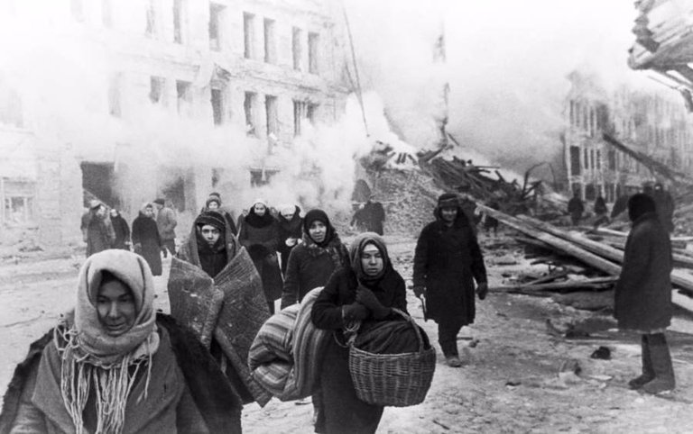Citizens of Leningrad, Soviet Union vacate their houses, destroyed by German bombing, on December 10, 1942..jpg
