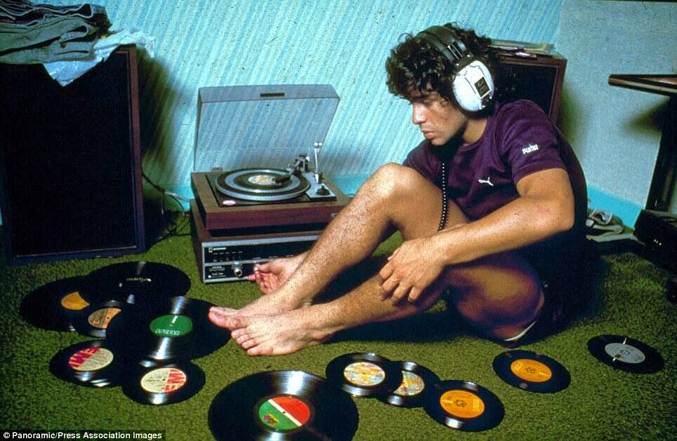 Diego-Maradona-listening-to-records-1980.jpg