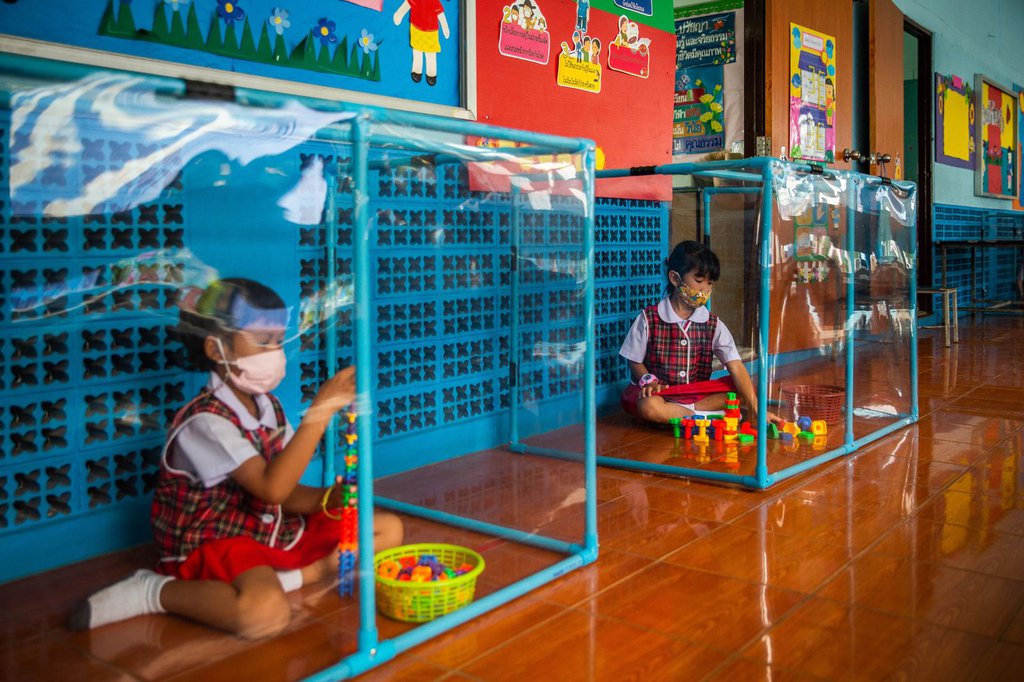 Kindergarten students wear face masks and play in screened-in areas at the Wat Khlong Toey School in Bangkok, Thailand, on August 10.Lauren DeCicca-Getty Images.jpg