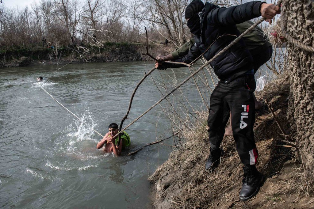 Migrants are rescued from the Evros river after trying to cross from Turkey into Greece on March 1 Burak Kara.jpg