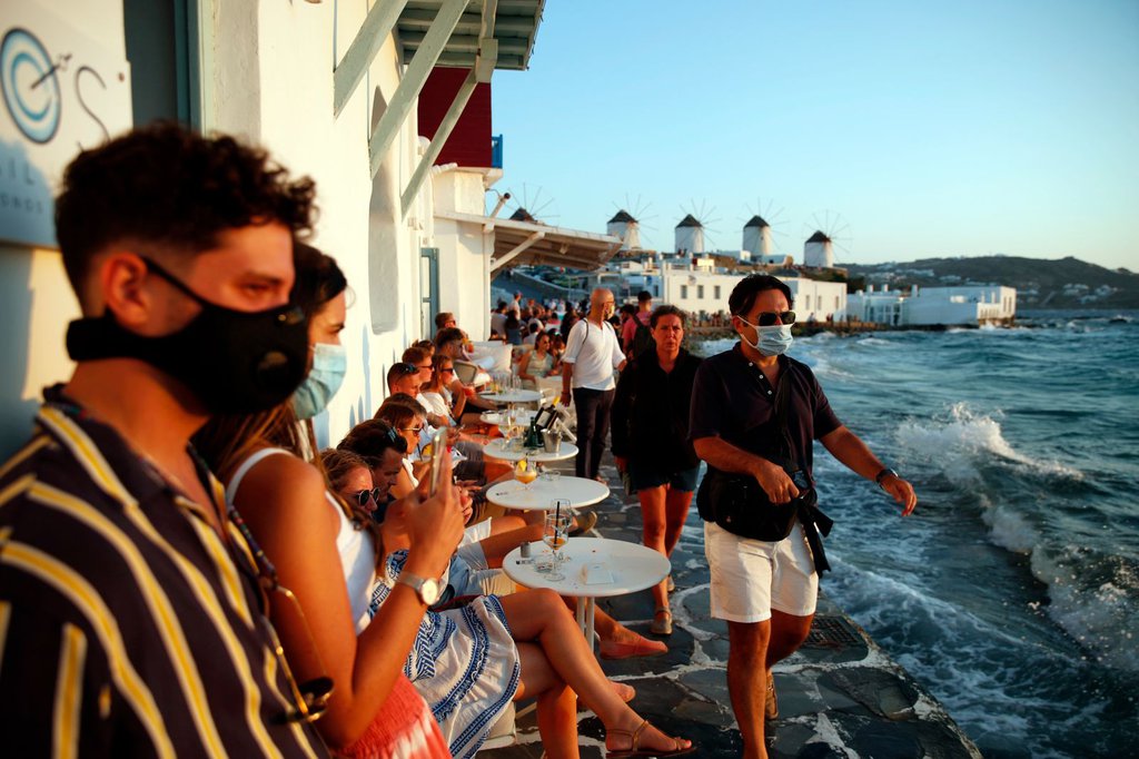 People gather in Little Venice on the Aegean Sea island of Mykonos, Greece, on Sunday, August 16.Thanassis Stavrakis-AP.jpg