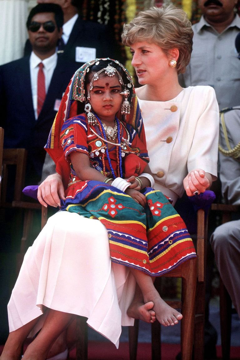Sitting with a local schoolgirl during her visit to Lallapet High School in Hyderabad, India 1992.jpg