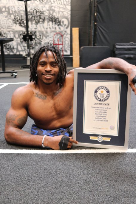 zion-clark-smiling-with-his-arm-around-his-gwr-certificate_tcm25-723080.jpg